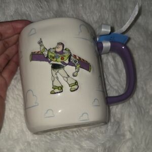 NWT Rae Dunn Pixar Ceramic Mug with Purple Handle